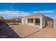 Home's backyard features a brick patio and mature trees at 22235 E Cherrywood Dr, Queen Creek, AZ 85142