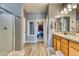 View of bathroom with shower, closet, and double vanity at 22235 E Cherrywood Dr, Queen Creek, AZ 85142