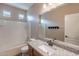 Bright bathroom showcasing a granite countertop and a shower-tub combination at 22235 E Cherrywood Dr, Queen Creek, AZ 85142