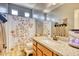 Bathroom with shower, granite vanity, and decorative shower curtain at 22235 E Cherrywood Dr, Queen Creek, AZ 85142