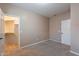 Bedroom featuring a walk-in closet and neutral carpet at 22235 E Cherrywood Dr, Queen Creek, AZ 85142