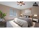 Virtually staged bedroom with natural light, blinds, and modern decor for a cozy feel at 22235 E Cherrywood Dr, Queen Creek, AZ 85142