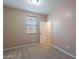 Carpeted bedroom with a closet and a window at 22235 E Cherrywood Dr, Queen Creek, AZ 85142