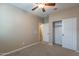 Bedroom featuring an open closet with sliding doors at 22235 E Cherrywood Dr, Queen Creek, AZ 85142