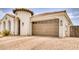 Two-car garage with decorative door and paver driveway at 22235 E Cherrywood Dr, Queen Creek, AZ 85142