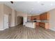 Spacious kitchen featuring an island, stainless steel appliances, and wood flooring at 22235 E Cherrywood Dr, Queen Creek, AZ 85142