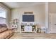 Cozy living room featuring a leather sofa and a farmhouse-style media console at 22235 E Cherrywood Dr, Queen Creek, AZ 85142