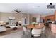 Staged living room and dining area with elegant furniture and decor at 22235 E Cherrywood Dr, Queen Creek, AZ 85142