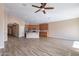 Bright and airy living space with wood-like tile floors and recessed lighting at 22235 E Cherrywood Dr, Queen Creek, AZ 85142