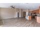 Open-concept living space with tile floors, flowing into the kitchen area at 22235 E Cherrywood Dr, Queen Creek, AZ 85142