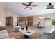 Staged living space that features a dining area and kitchen with stainless steel appliances at 22235 E Cherrywood Dr, Queen Creek, AZ 85142