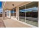 Covered patio with sliding door and view of the backyard at 22235 E Cherrywood Dr, Queen Creek, AZ 85142