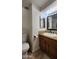 Clean bathroom with wood vanity and updated fixtures at 2233 E Behrend Dr # 61, Phoenix, AZ 85024