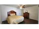 Bright bedroom with wood headboard and ceiling fan at 2233 E Behrend Dr # 61, Phoenix, AZ 85024