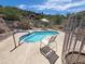 Relaxing kidney-shaped pool with patio furniture at 2233 E Behrend Dr # 61, Phoenix, AZ 85024