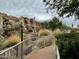 Landscaped pathway alongside a scenic waterfall feature at 2233 E Behrend Dr # 61, Phoenix, AZ 85024