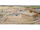 Aerial view showcasing a house's location within a new development, near a lake at 22707 W La Mirada Dr, Buckeye, AZ 85326