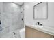 Modern bathroom with gray tile and floating vanity at 22707 W La Mirada Dr, Buckeye, AZ 85326