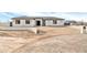 Modern house exterior, featuring a clean white facade and a gray tile roof at 22707 W La Mirada Dr, Buckeye, AZ 85326