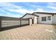 Modern home with paver driveway and gate at 22707 W La Mirada Dr, Buckeye, AZ 85326