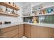 Well-organized pantry with ample shelving and modern finishes at 22707 W La Mirada Dr, Buckeye, AZ 85326