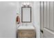 Small bathroom with a vanity, mirror, and a single sink at 22812 E Excelsior Ave, Queen Creek, AZ 85142