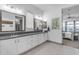 Modern bathroom with double vanity and patterned tile floor at 22812 E Excelsior Ave, Queen Creek, AZ 85142