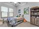 bedroom with a bookshelf and twin bed at 22812 E Excelsior Ave, Queen Creek, AZ 85142