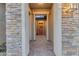 Inviting entryway with stone accents and a charming red door at 22812 E Excelsior Ave, Queen Creek, AZ 85142