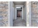 Inviting entryway with stone accents and a charming red door at 22812 E Excelsior Ave, Queen Creek, AZ 85142