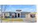 Single-story home with stone accents and landscaping at 22812 E Excelsior Ave, Queen Creek, AZ 85142