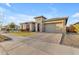 Ranch home exterior with a two-car garage at 22812 E Excelsior Ave, Queen Creek, AZ 85142