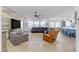 Relaxing living room featuring a sectional sofa and accent chair at 22812 E Excelsior Ave, Queen Creek, AZ 85142