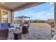 Covered patio with seating area and outdoor kitchen at 22812 E Excelsior Ave, Queen Creek, AZ 85142