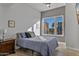 Bright bedroom with city view and striped bedding at 2302 N Central Ave # 401, Phoenix, AZ 85004