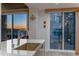 Modern kitchen features stainless steel sink, updated faucet, and sunset views from sliding glass doors at 2302 N Central Ave # 401, Phoenix, AZ 85004