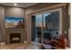 Living room features a fireplace and sliding glass doors leading to a balcony with sunset views at 2302 N Central Ave # 401, Phoenix, AZ 85004