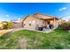 Backyard with patio, grass, and seating area at 24246 W Tonto St, Buckeye, AZ 85326