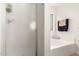 Bathroom with a shower and tub at 24246 W Tonto St, Buckeye, AZ 85326