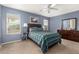 Bedroom with ceiling fan, ample closet space, and ensuite bathroom at 24246 W Tonto St, Buckeye, AZ 85326