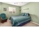 Bedroom with a queen bed and rocking chair at 24246 W Tonto St, Buckeye, AZ 85326