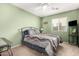 Bedroom with a queen bed and ceiling fan at 24246 W Tonto St, Buckeye, AZ 85326