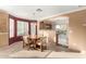 Bright dining area with wood table and chairs, adjacent to kitchen at 24246 W Tonto St, Buckeye, AZ 85326