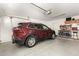 Garage with space for a car and workshop area at 24246 W Tonto St, Buckeye, AZ 85326