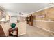 Living room featuring a built-in entertainment center and ceiling fan at 24246 W Tonto St, Buckeye, AZ 85326