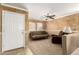 Living room with seating area, a half wall, and neutral-toned decor at 24246 W Tonto St, Buckeye, AZ 85326