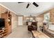 Living room with seating area, a half wall, and neutral-toned decor at 24246 W Tonto St, Buckeye, AZ 85326