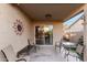 Relaxing covered patio with seating and sliding glass door access at 24246 W Tonto St, Buckeye, AZ 85326