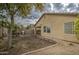 Backyard view of house with patio and grassy area at 2524 W Saint Catherine Ave, Phoenix, AZ 85041