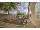 Landscaped backyard with patio and a view of the house at 2524 W Saint Catherine Ave, Phoenix, AZ 85041